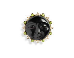 One 14kt gold brooch, carved jet face, green tourmaline, diamonds