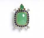 One 18kt yellow gold and platinum brooch, green chrysoprase, emerald, garnets, blue sapphires, diamonds