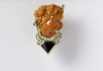 One 14kt yellow gold brooch, carved coral, white and black diamonds